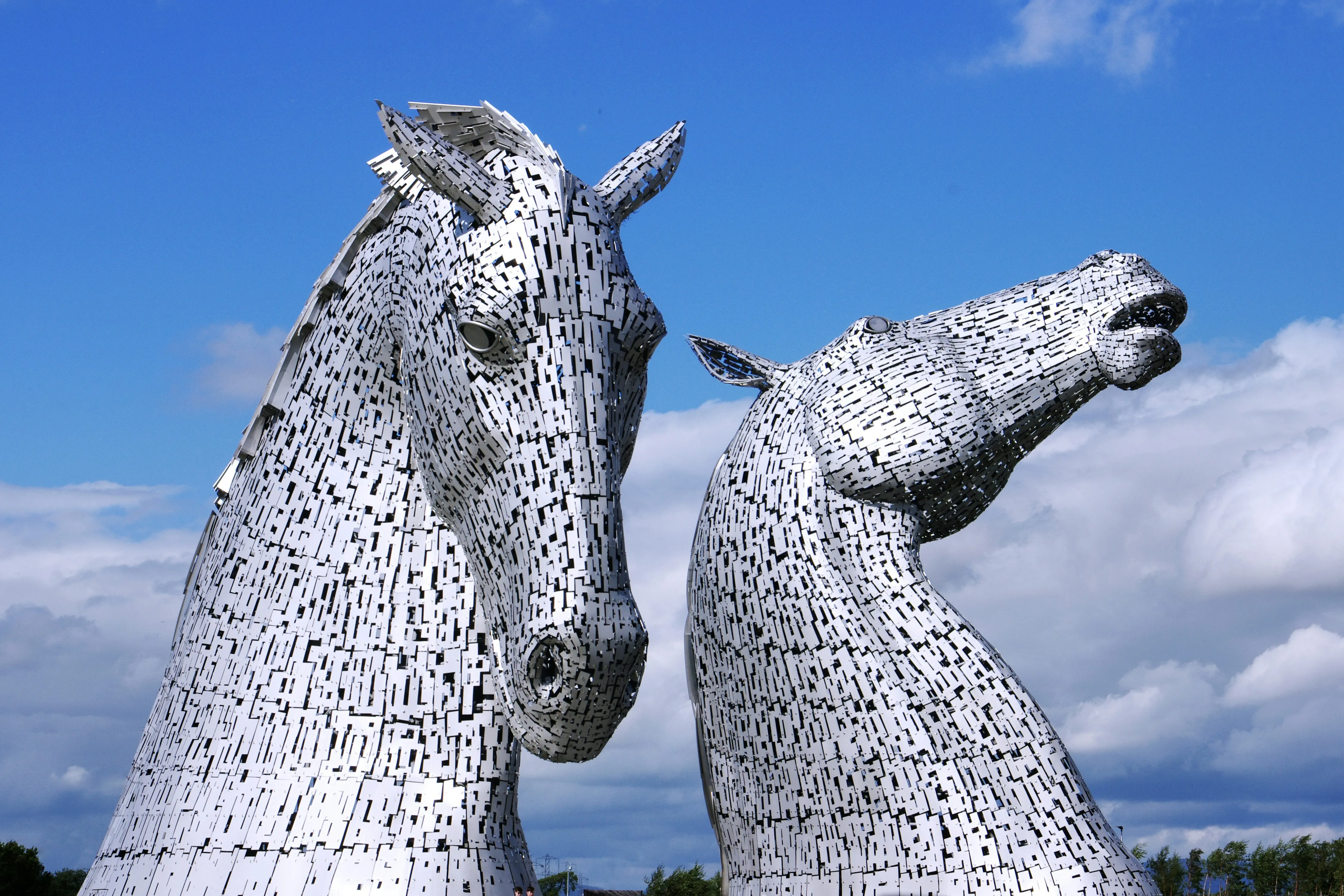 The Kelpies sculptures in Falkirk against a blue sky
